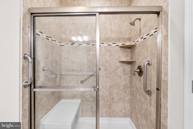 full bath with a shower stall