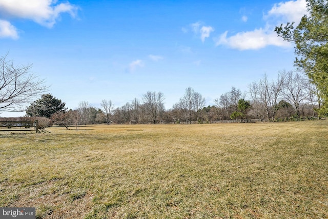 view of yard with a rural view