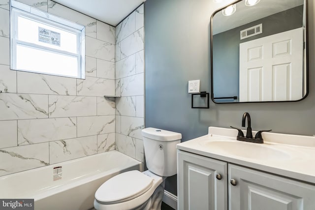 bathroom with toilet, washtub / shower combination, visible vents, and vanity