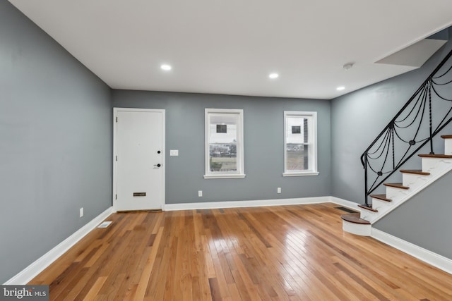 entrance foyer with recessed lighting, stairway, baseboards, and hardwood / wood-style flooring