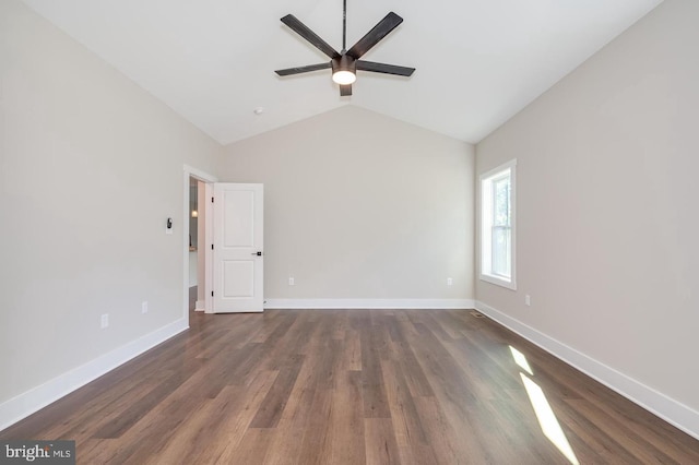 unfurnished room with lofted ceiling, ceiling fan, baseboards, and dark wood-type flooring