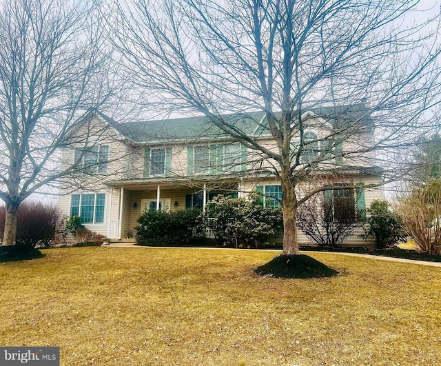 traditional-style home with a front yard