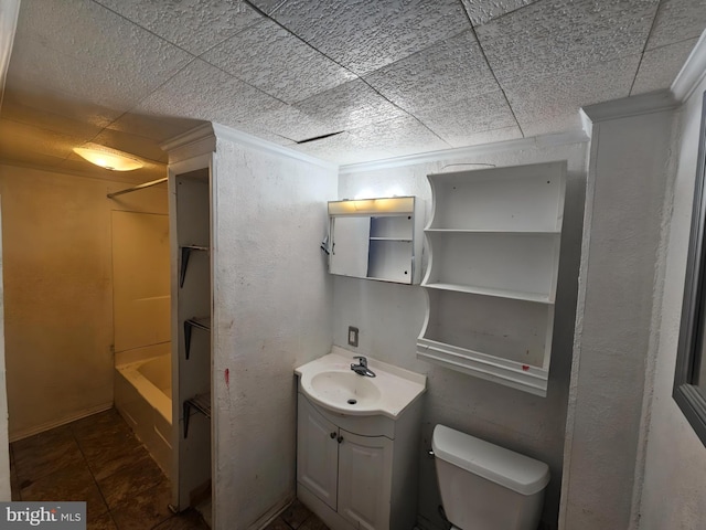 bathroom featuring toilet, shower / bathing tub combination, a paneled ceiling, and vanity