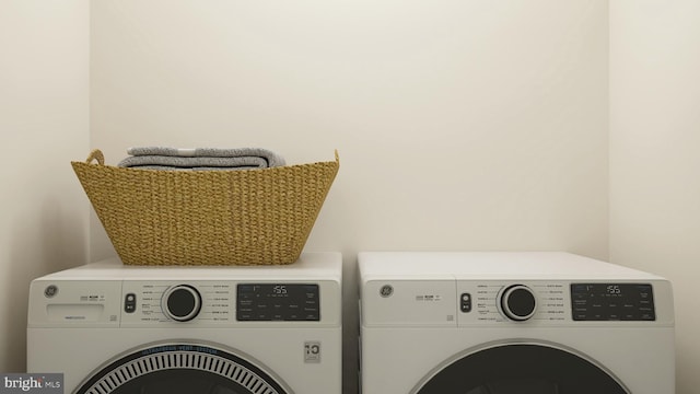 washroom with laundry area and washer and dryer