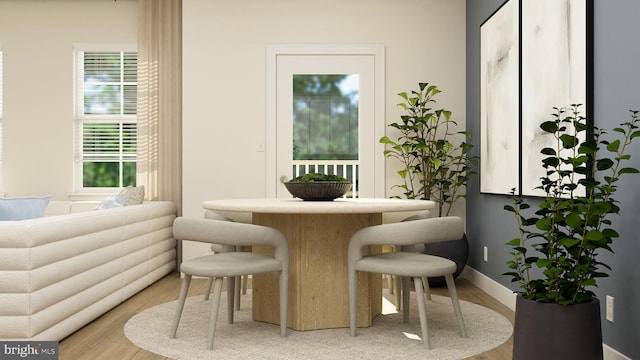 bar featuring baseboards and light wood finished floors