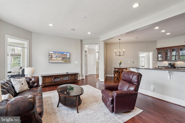 living room with baseboards, dark wood-style flooring, and recessed lighting