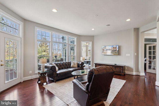 living area with recessed lighting, dark wood-style flooring, french doors, and baseboards