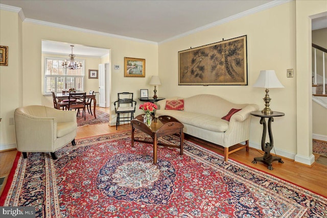 living room featuring stairs, crown molding, and wood finished floors