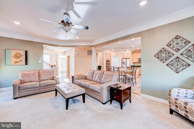 living room featuring ornamental molding, light colored carpet, and visible vents