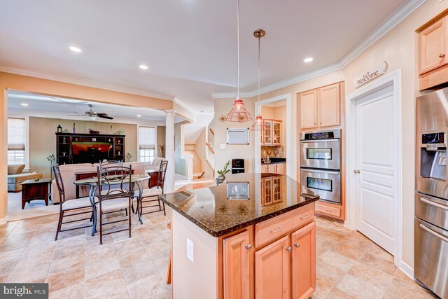 kitchen with crown molding, stainless steel appliances, light brown cabinetry, open floor plan, and dark stone counters