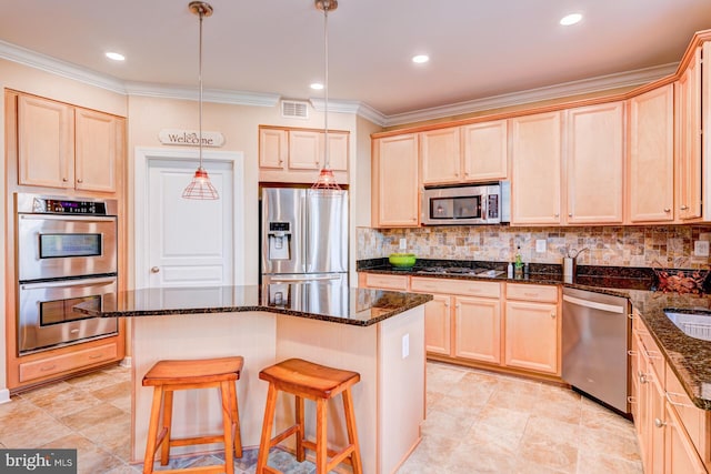 kitchen featuring stainless steel appliances, light brown cabinetry, visible vents, and tasteful backsplash