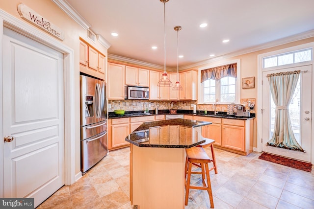 kitchen featuring ornamental molding, appliances with stainless steel finishes, and tasteful backsplash