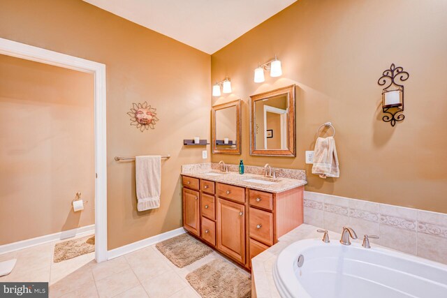 bathroom featuring double vanity, a garden tub, a sink, and tile patterned floors