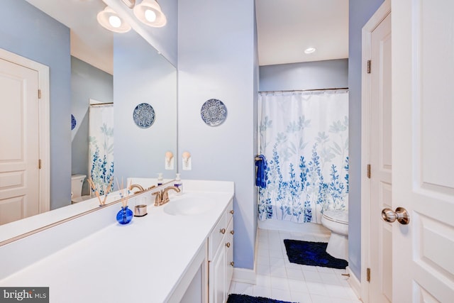 bathroom with curtained shower, vanity, toilet, and tile patterned floors