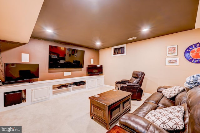 living area featuring carpet floors, visible vents, and recessed lighting