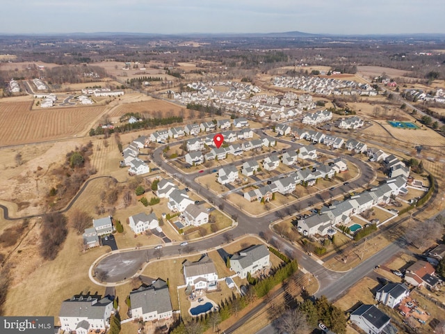 birds eye view of property with a residential view