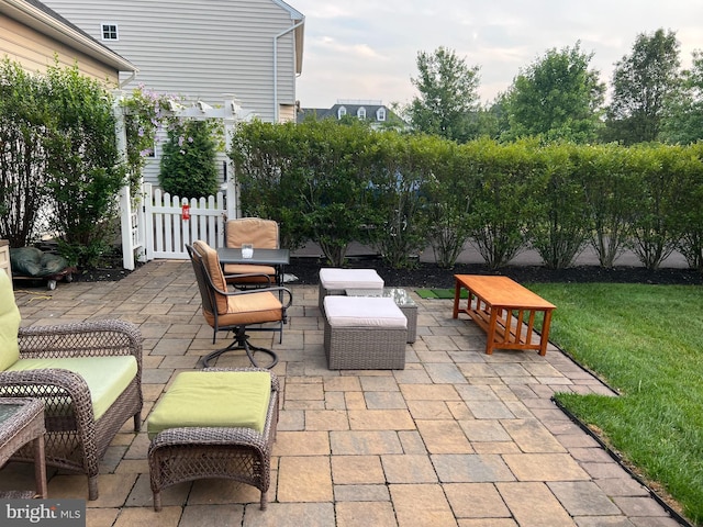 view of patio with fence and outdoor lounge area