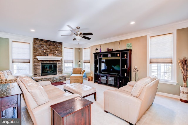 living area featuring ceiling fan, baseboards, ornamental molding, and light colored carpet