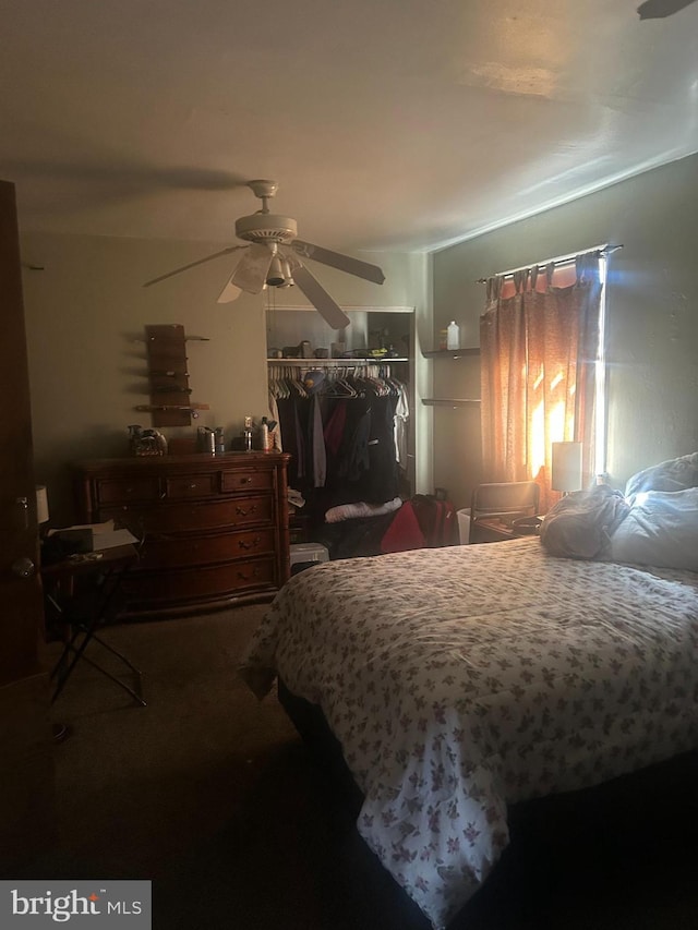 bedroom featuring a ceiling fan and a closet