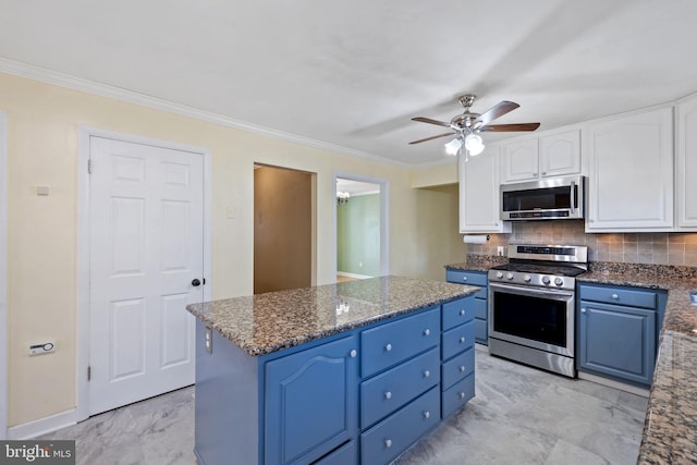 kitchen featuring marble finish floor, appliances with stainless steel finishes, white cabinetry, and blue cabinets