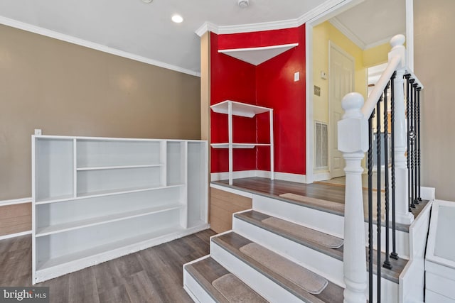 staircase featuring crown molding, recessed lighting, wood finished floors, and visible vents