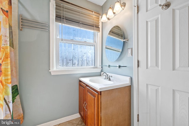 full bathroom with baseboards, vanity, and tile patterned flooring