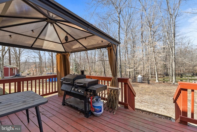 wooden deck featuring a gazebo