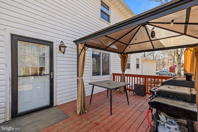 deck featuring a gazebo and grilling area