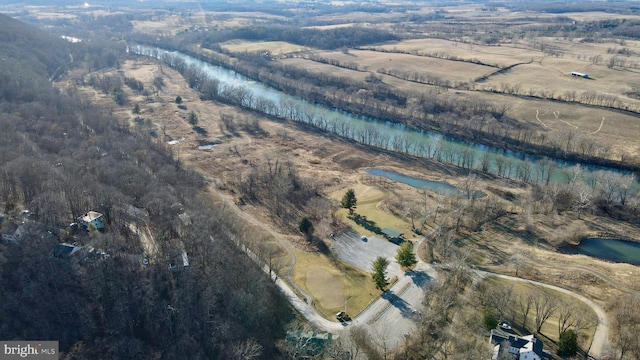 drone / aerial view with a rural view and a water view