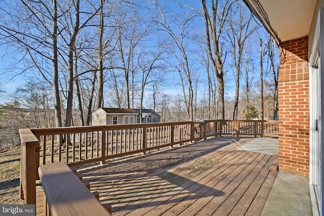 wooden deck featuring an outdoor structure