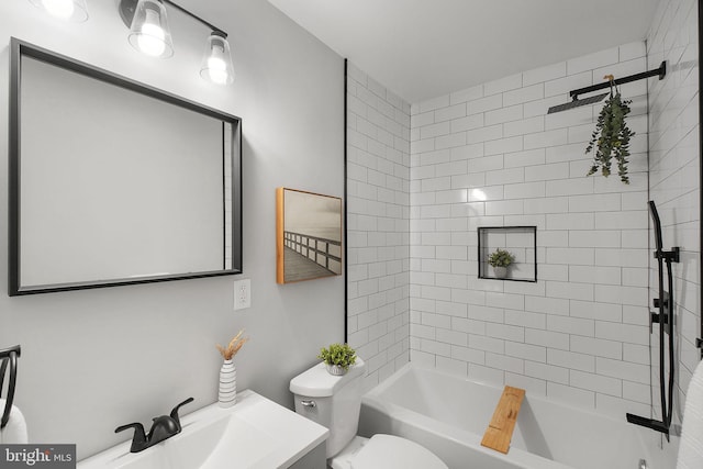 bathroom with shower / bath combination, vanity, and toilet