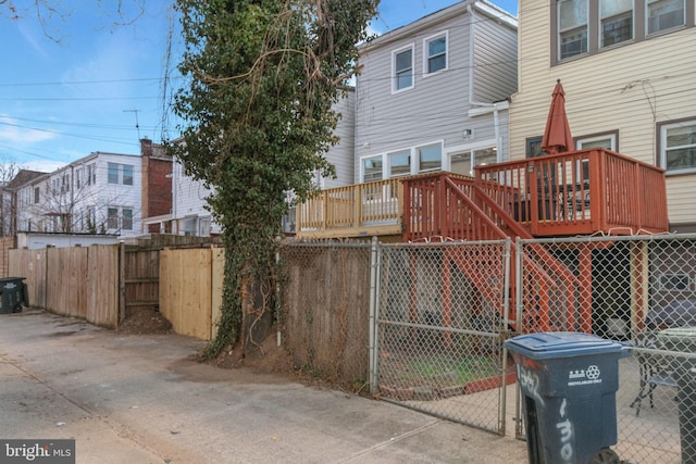 exterior space featuring fence and a wooden deck