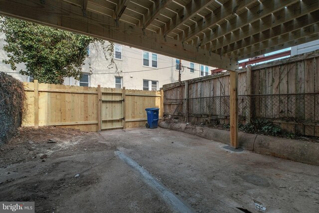 view of patio / terrace featuring a gate and fence