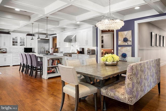 dining area with beamed ceiling, dark wood-style floors, coffered ceiling, and a chandelier