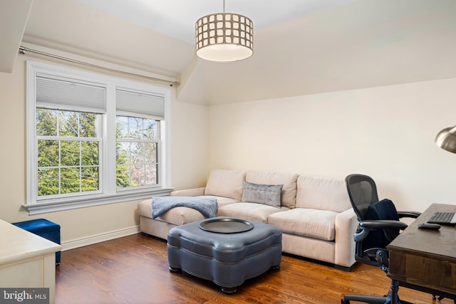 office space featuring baseboards and wood finished floors