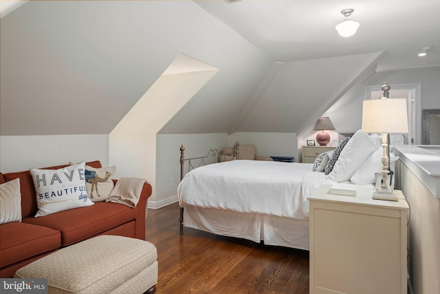 bedroom with dark wood-style floors and vaulted ceiling