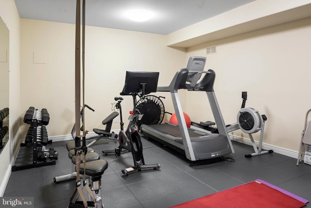 exercise area with visible vents and baseboards