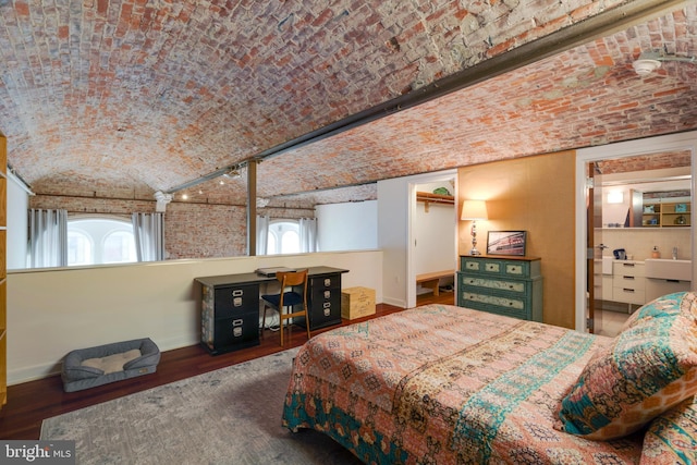 bedroom featuring brick ceiling, vaulted ceiling, dark wood-style floors, and baseboards