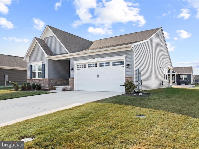 view of front facade with a shingled roof, a front yard, concrete driveway, and an attached garage