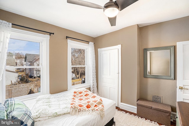 bedroom with visible vents, ceiling fan, and baseboards