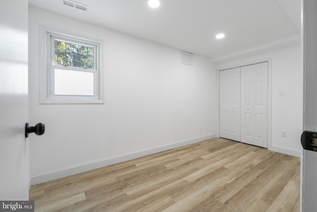 unfurnished bedroom with light wood-style floors, recessed lighting, visible vents, and baseboards