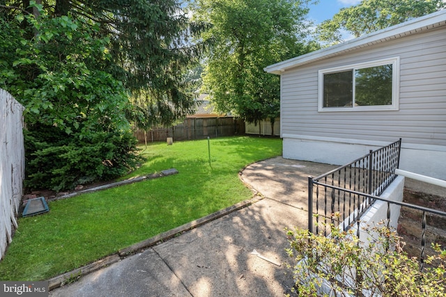 view of yard with a patio and a fenced backyard