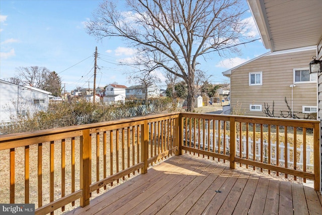 wooden deck with a residential view