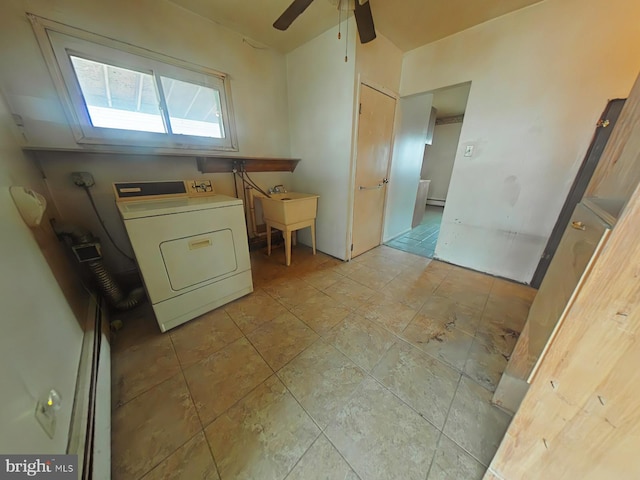 laundry area featuring washer / dryer, laundry area, a sink, and ceiling fan