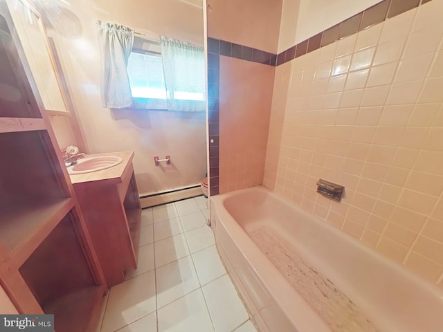 bathroom with toilet, baseboard heating, vanity, and tile patterned floors