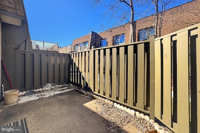 view of patio featuring fence