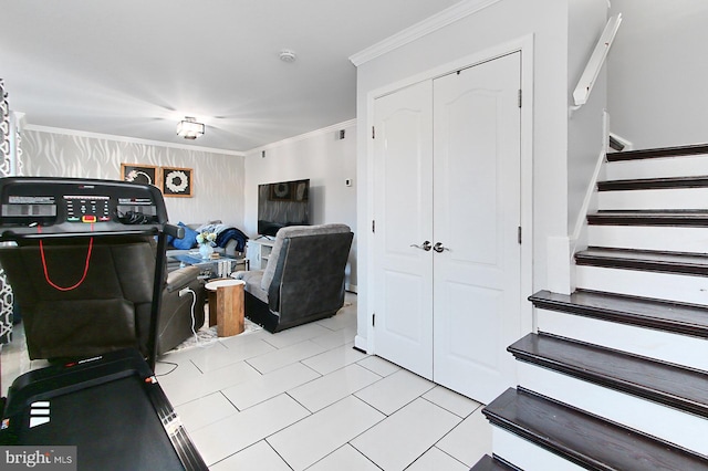 interior space with light tile patterned floors and ornamental molding