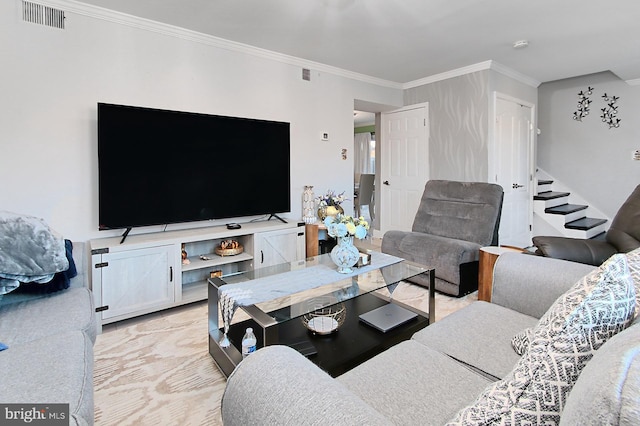 living area featuring stairs, ornamental molding, and visible vents