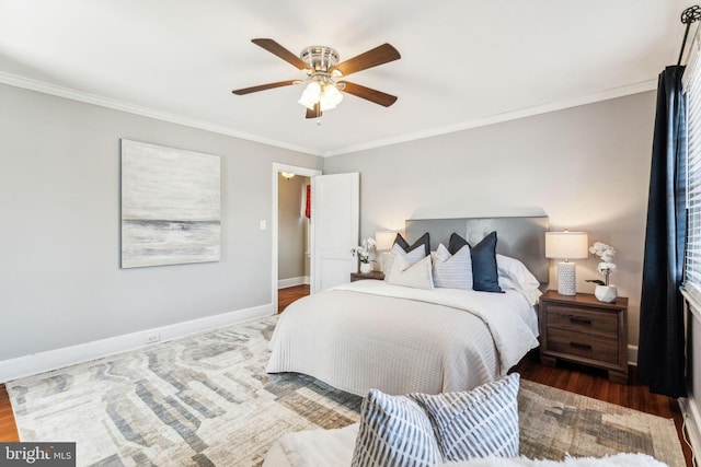 bedroom featuring ceiling fan, baseboards, dark wood-type flooring, and ornamental molding