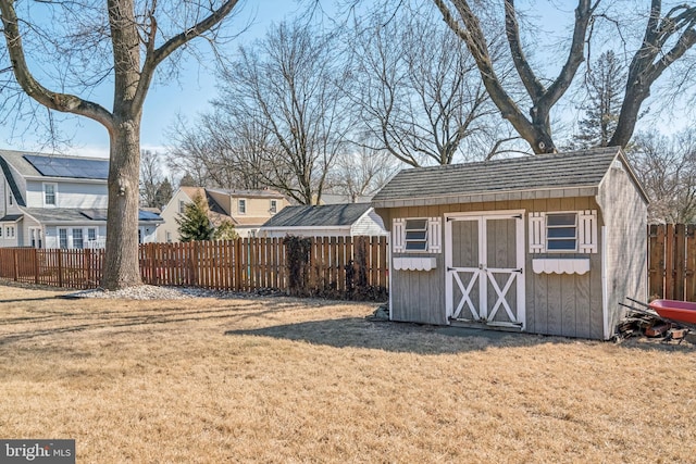 view of shed with a fenced backyard